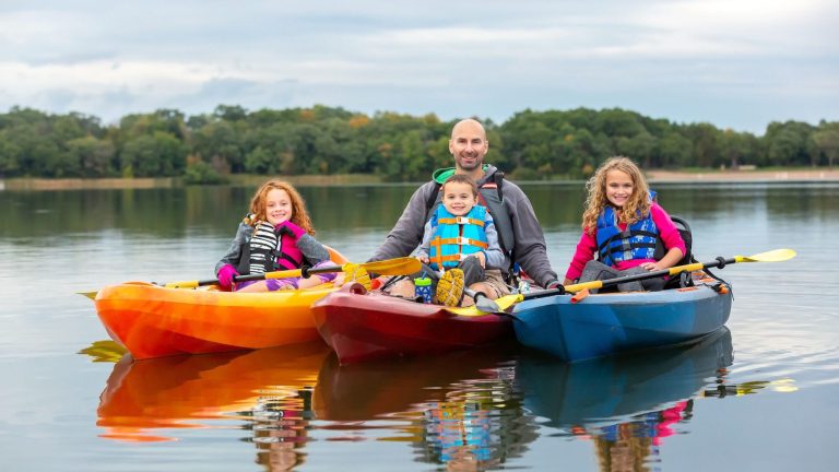 Dad kayaking with daughters and his son x