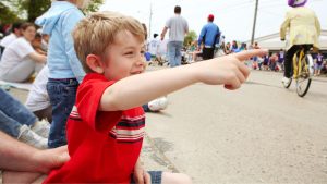 Small Town Parade Boy Excited