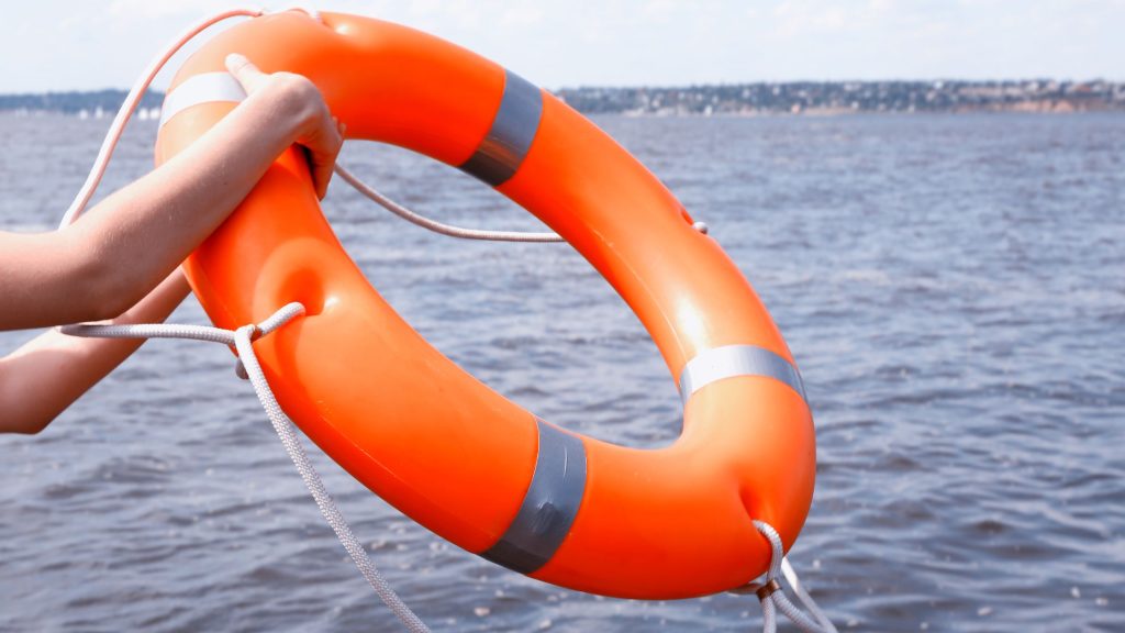 Life ring held over the open water