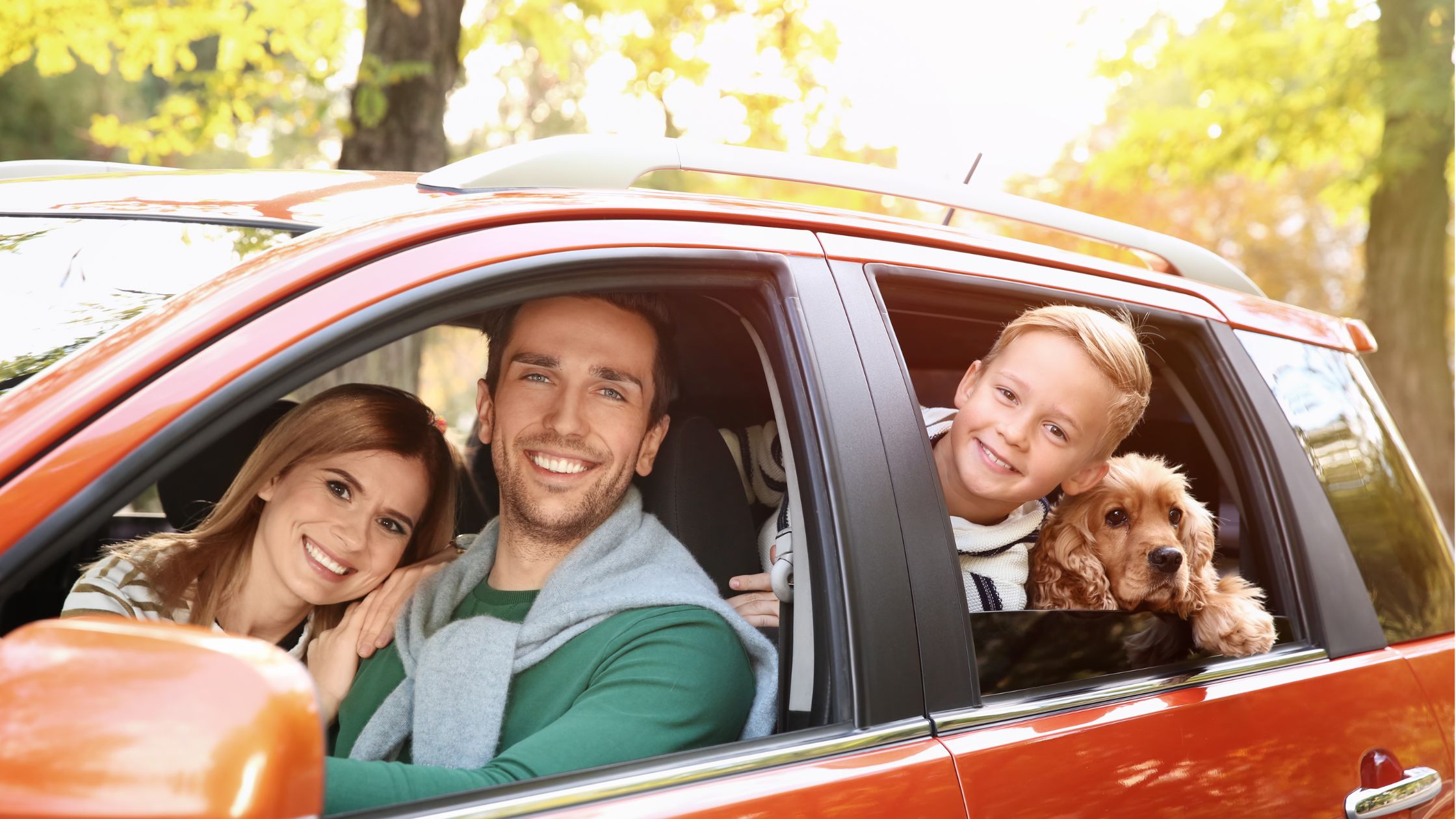 Family in car with dog - Lake.com family cars report