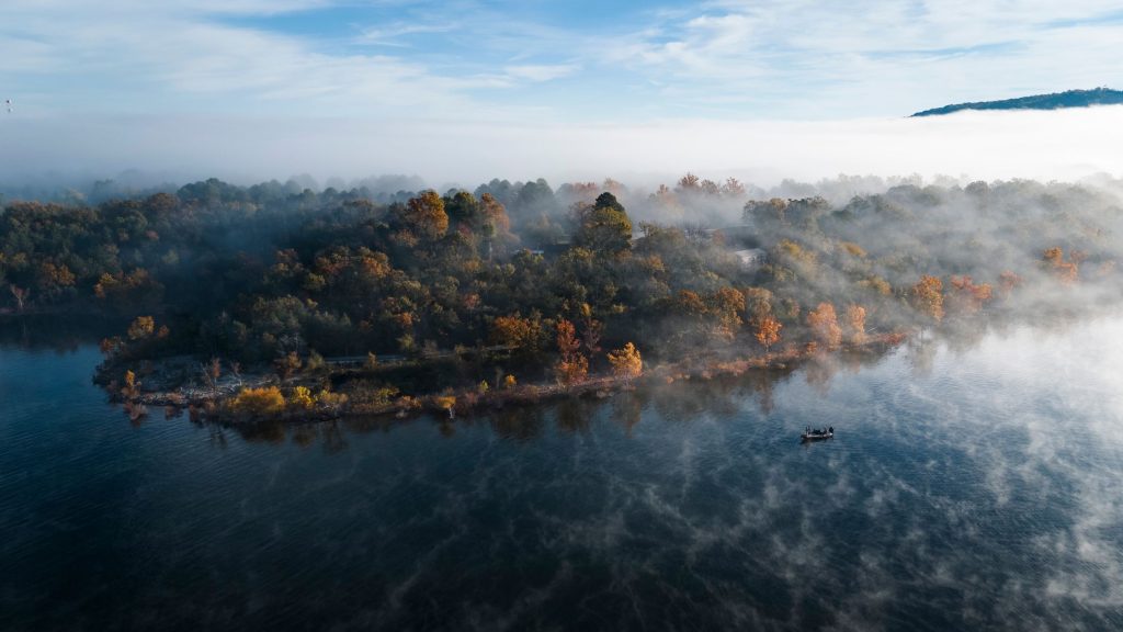 Fishermen fishing on a foggy fall morning on Table Rock Lake
